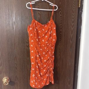 Short orange summer dress.